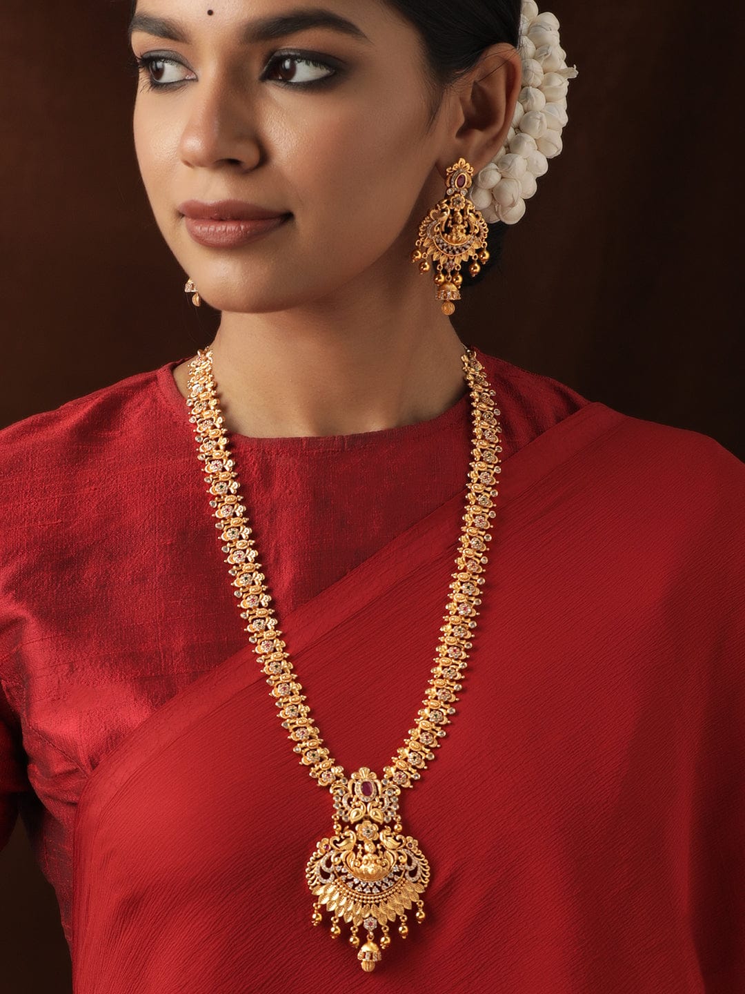 Rubans 22K Gold Plated Red Kemp Stone studded Handcrafted Floral Temple Long Necklace Set Jewellery Sets